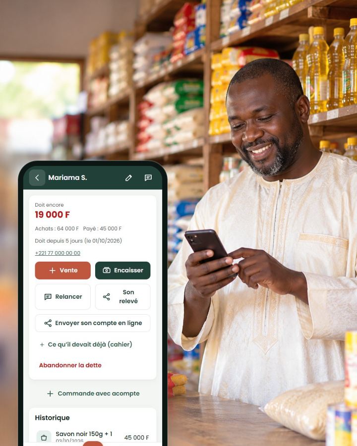 La fiche d’un client qui doit de l’argent, devant un commerçant dans sa boutique